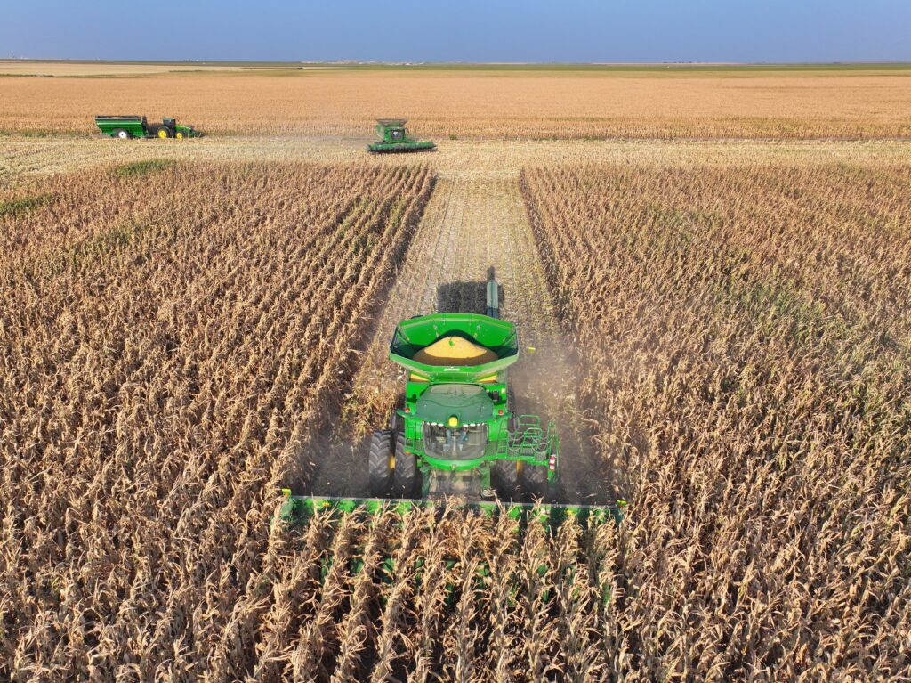 A tractor is in the middle of a field.