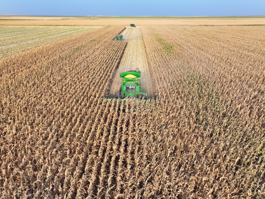 A tractor is in the middle of an open field.