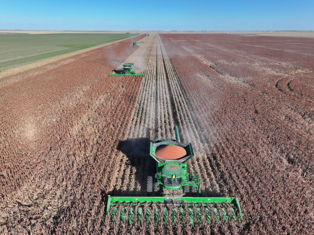 A tractor is in the middle of an empty field.