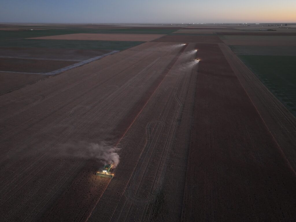 A tractor spraying the ground with water.